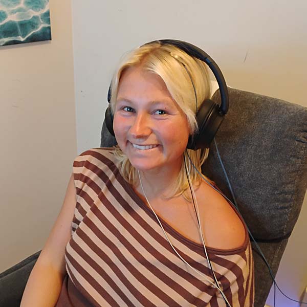 Smiling Client Participating in Neurofeedback Service in a Calm Environment